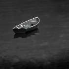 Lone boat in water. Art Print